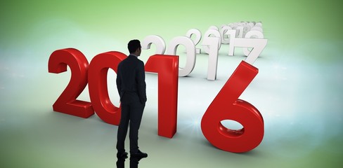 Composite image of businessman standing