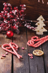 Christmas candies on rustic wooden board