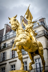 The golden statue of Saint Joan of Arc on the Rue de Rivoli in Paris, France..sculpted by Emmanuel...