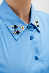 Woman in the blue shirt