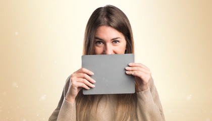 Girl holding an grey placard