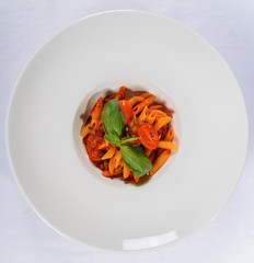 Snack from macaroni under tomato sauce