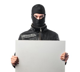 Robber holding an empty placard