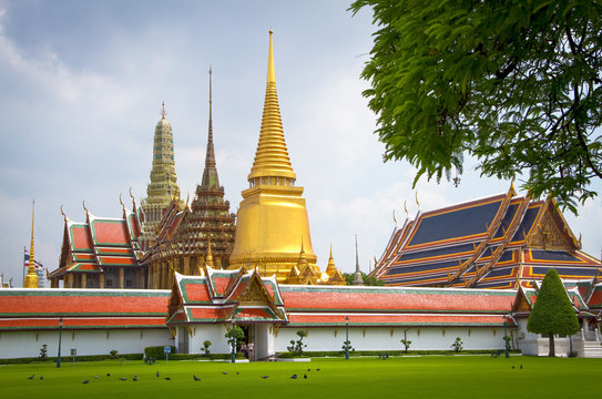 Three stupas seen from outside perimeter of Grand Palace in Bangkok, Thailand