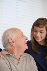 girl having fun with her grandfather