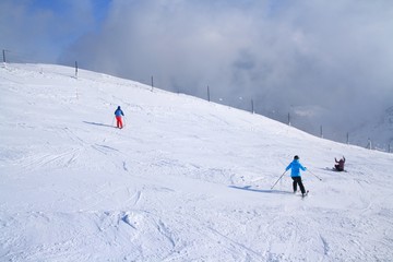 Skiers on ski resort Krvavec in Slovenian Alps