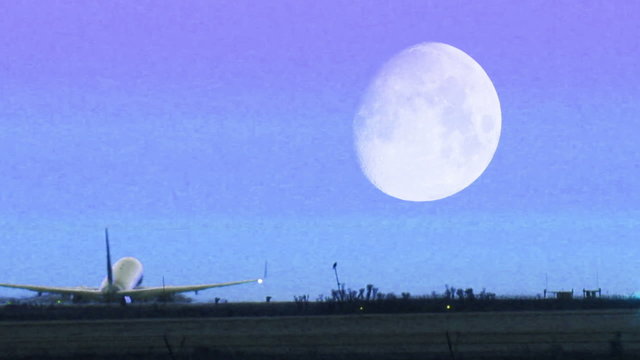 HD footage of a twin engine plane taking off in silhouette against an orange sky.