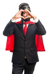 Super hero businessman making a heart with his hands