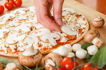 Food ingredients for pizza on table close up