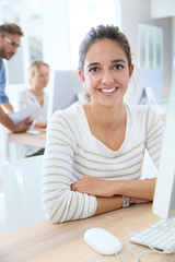 Portrait of smiling student in computing class