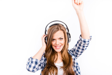 cute happy girl with glasses  enjoying  music on headphones and