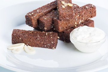 roasted garlic croutons, sour cream on a white background