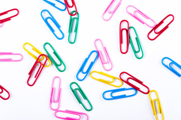 colored paper clips on a white background