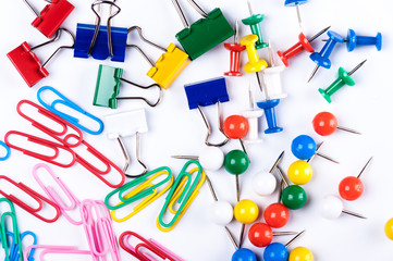 colored paper clips on a white background