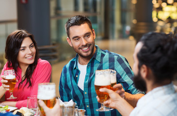friends dining and drinking beer at restaurant