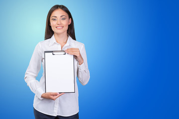 young business woman standing with her clipboard