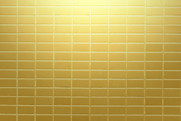 Gold wall blick bright on background texture.