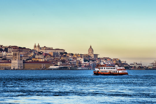 Passenger boat (Cacilheiro) in the Tagus River with the Lisbon skyline in the back