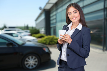 Business woman portrait with cup