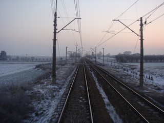 Winter landscape with railroad at dawn
