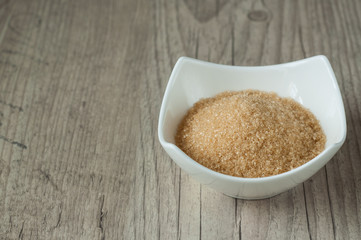 cane brown sugar in white bowl