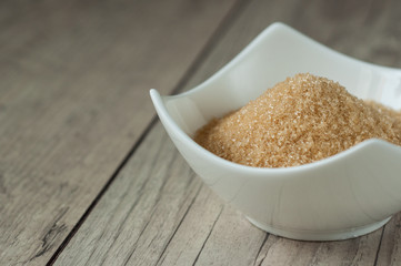 cane brown sugar in white bowl