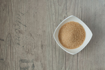 cane brown sugar in white bowl