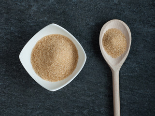 cane brown sugar in white bowl