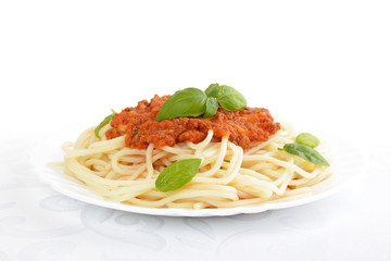 Spaghetti ragu bolognese sauce on white,close up