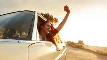 Young woman enjoying road trip