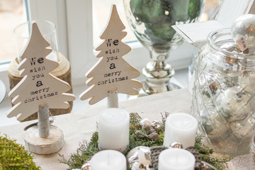 shot of a advent wreath with baubles and candles