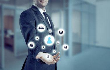 businessman points to icon-HR, recruitment and chosen concept