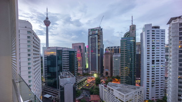 Kuala Lumpur, Malaysia- circa October 2015 :Beautiful Day to Night Sunrise Scene Over Kuala Lumpur City. Time Lapse. Showing the Famous Kuala Lumpur Tower and other bulding nearby.