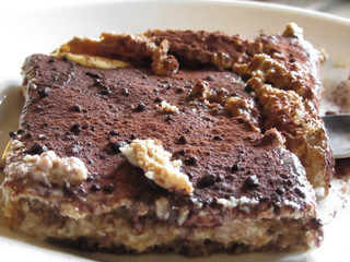 Tiramisu cake . Italian classical dessert with mascarpone and coffee