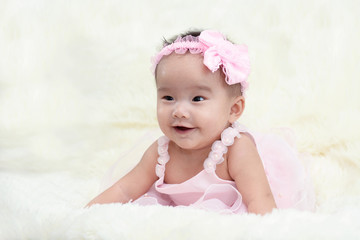 Baby dressed in a beautiful princess in the living room.