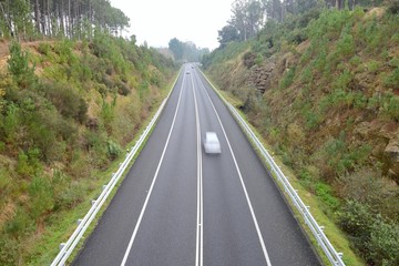 blurred image of a car in motion on the highway