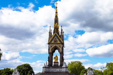 Fototapeta na wymiar Albert Memorial in London situated in Kensington Gardens, directly to the north of the Royal Albert Hall. Opened in July 1872 by Queen Victoria. London. UK