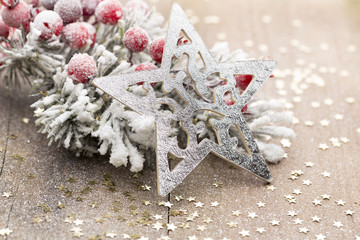 Christmas decoration with fir branches on the wood background.