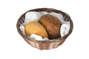 Dark and white buns in a basket isolated