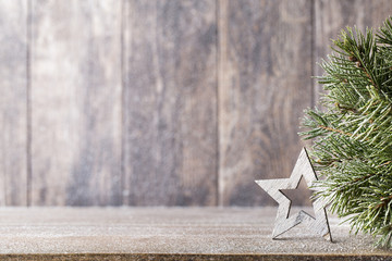 Christmas fir branch and decor, on the wooden background.
