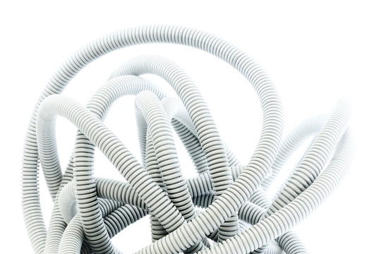 Corrugated pipe for electrical installations on white background