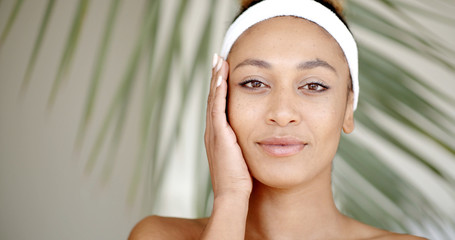 Woman With Makeup Touching Her Face