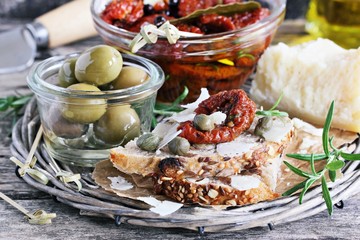 Mediterranean appetizers on a rustic wooden table.Selective focus