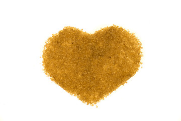 A heart made of brown sugar on a white background