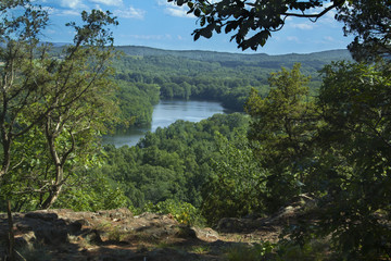 Trees framing Hart Ponds below ridge of Ragged Mountain, Connecticut.