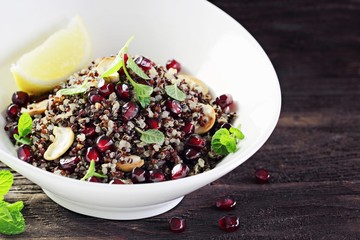 Quinoa salad with pomegranate and nuts.Concept of healthy eating. 