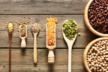 Bowls and spoons of various legumes