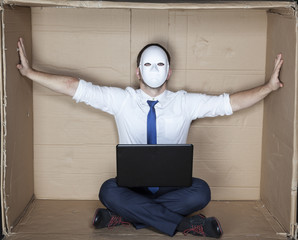businessman in a mask displaces office wall
