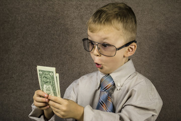 Boy examines dollars