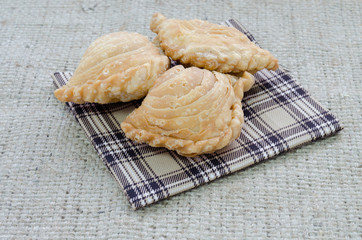 Yummy curry puff on chess pattern cloth